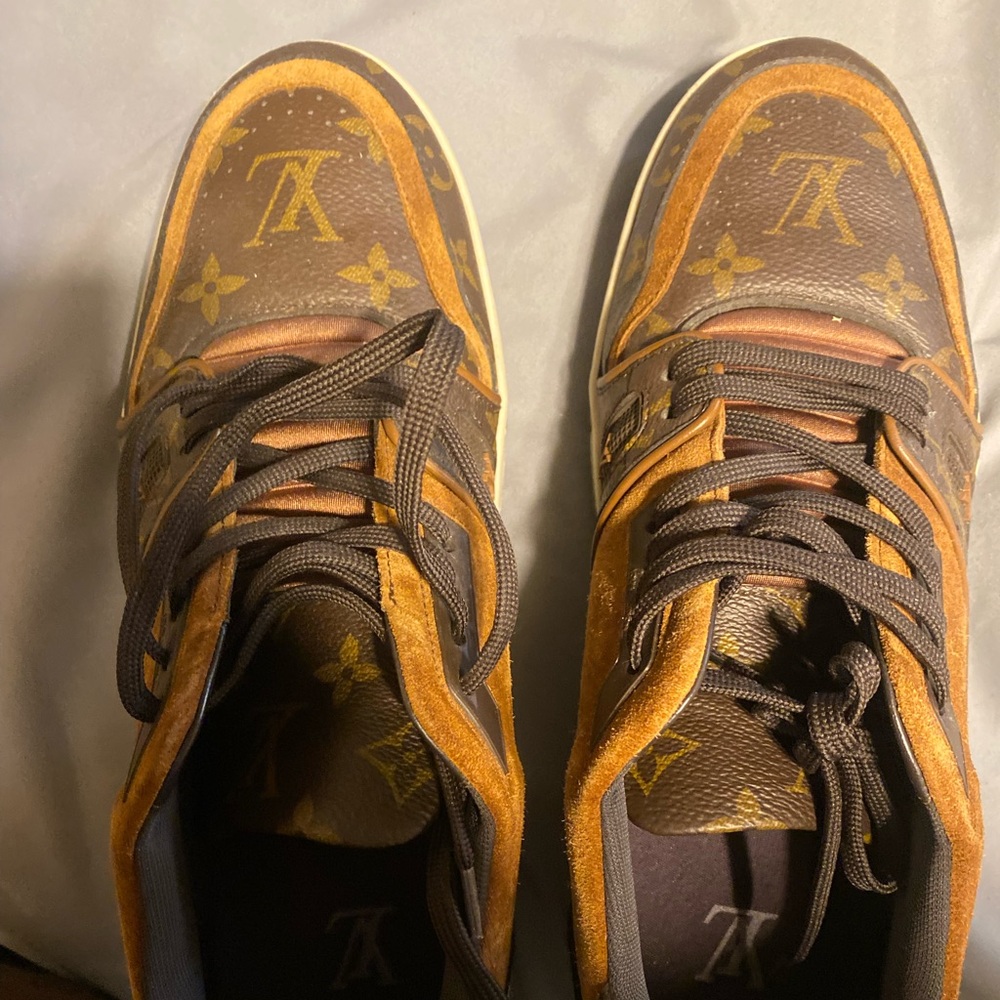 A pair of USED Louis Vuitton sneakers